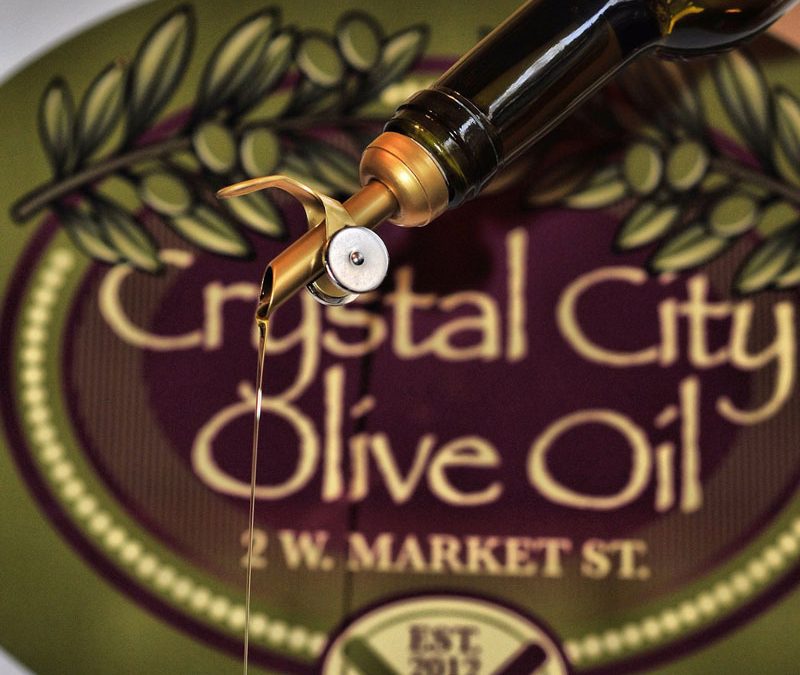 Crystal-City-Olive-Oil-Owego-Logo-and-Oil-Being-Poured